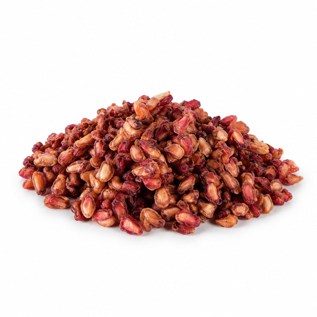 Create a photorealistic, high-end commercial product photograph of the uploaded Pomegranate Seeds (Natural), rendered fr
