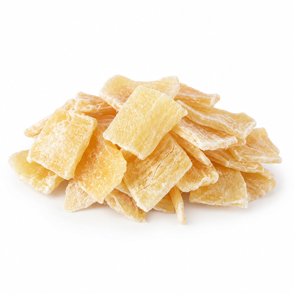 Create a photorealistic, high-end commercial product photograph of the uploaded Dried Aloe Vera Chunks, rendered from a